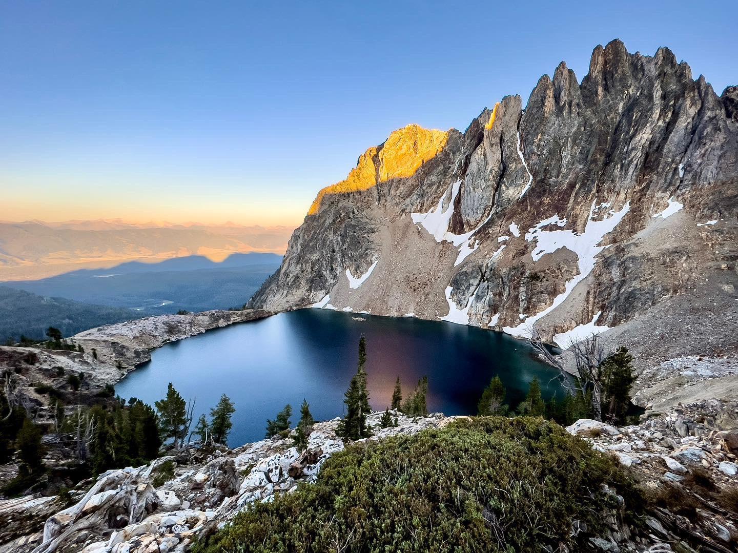 Sawtooth peaks and alpine lake
